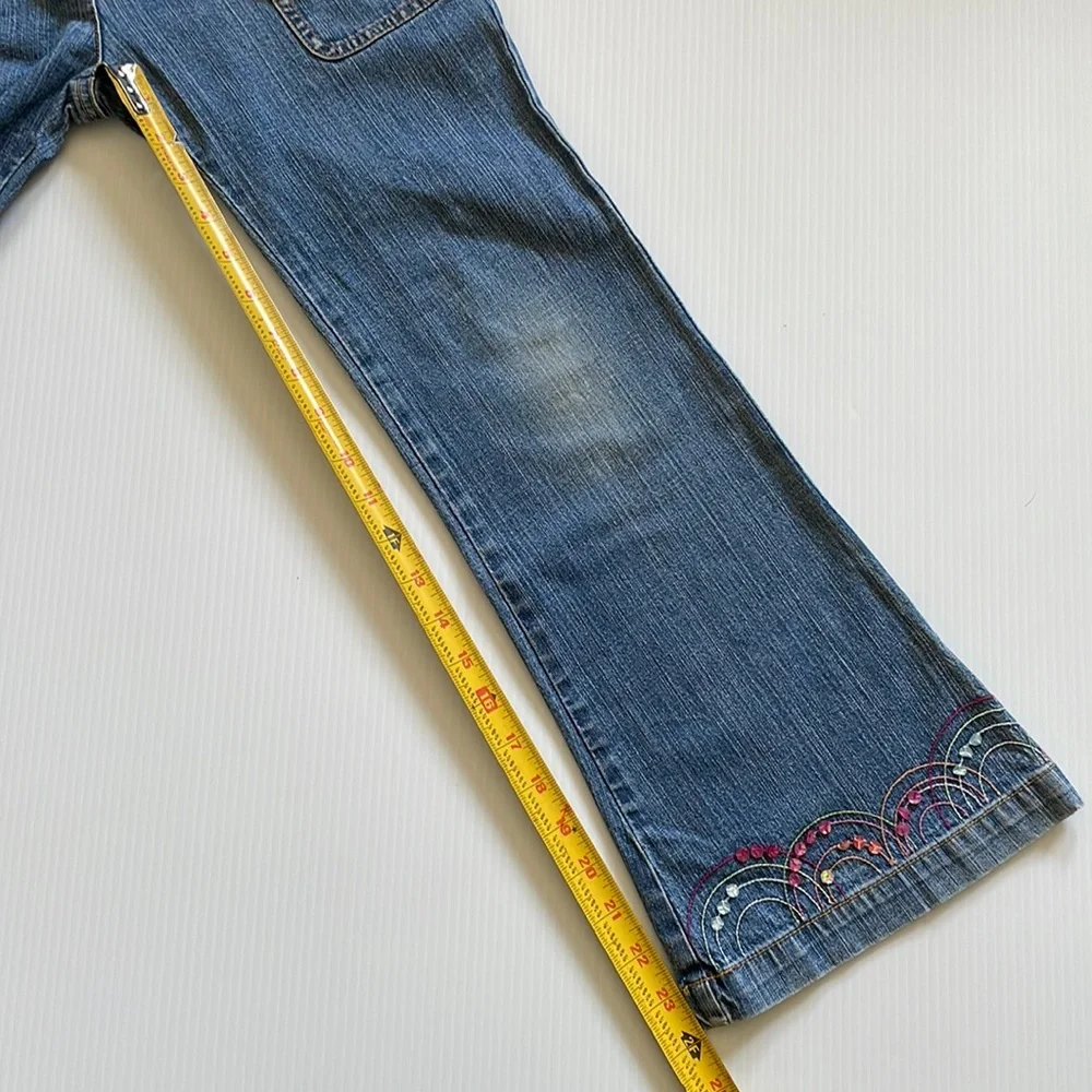 Flared Gymboree jeans with rainbow stitching & beading.  Girls size 9